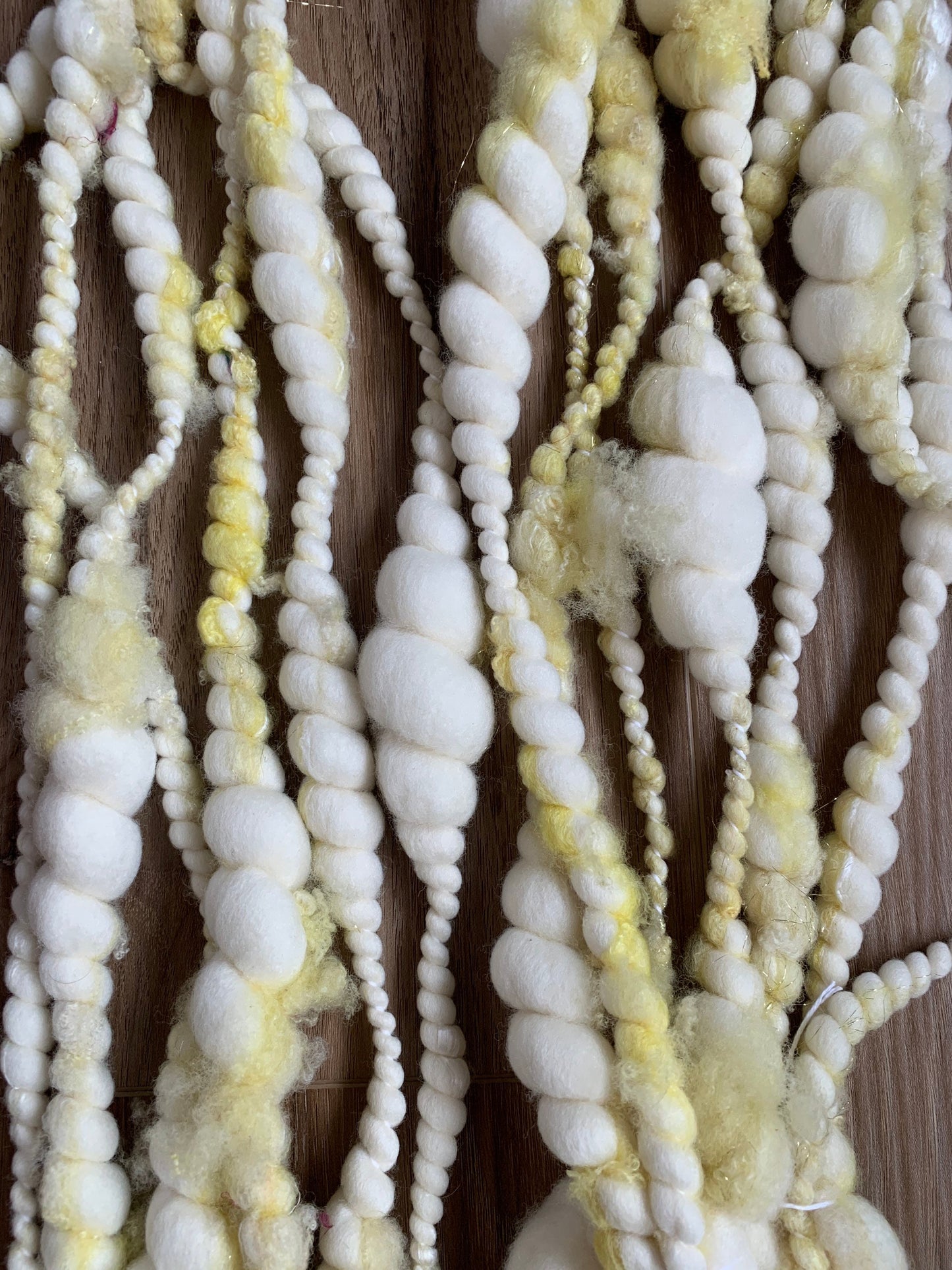 Handspun Art Yarn: Chunky Merino yarn with pale yellow locks